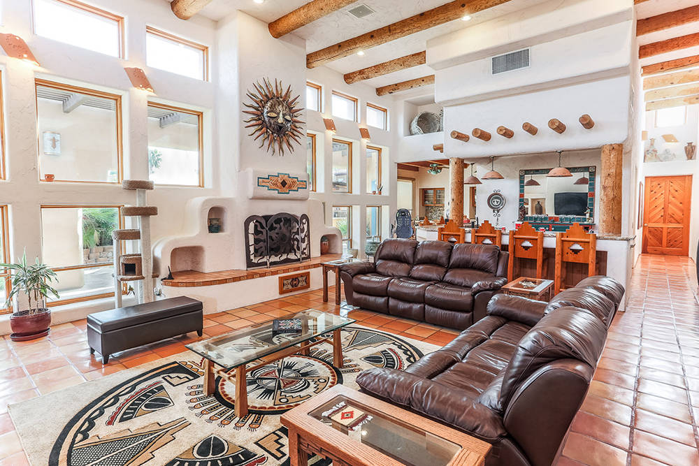 Courtesy of Avi Dan-Goor with Berkshire Hathaway HomeServices Nevada Properties
The Southwestern style is evident in the living room, which has its own bar.