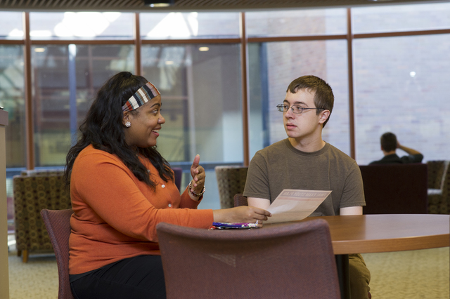 Freshman Nathan Terrell, who has autism, meets with his mentor Atiya Smith, a licensed therapist and doctoral student in counseling at the University of Rochester. Thanks to the Spectrum Support P ...