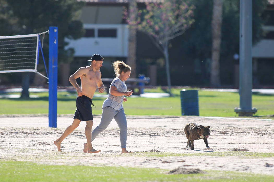 Joggers get in exercise in the sand of volleyball courts at Sunset Park in Las Vegas on Friday, March 24, 2017. (Brett Le Blanc/Las Vegas Review-Journal) @bleblancphoto