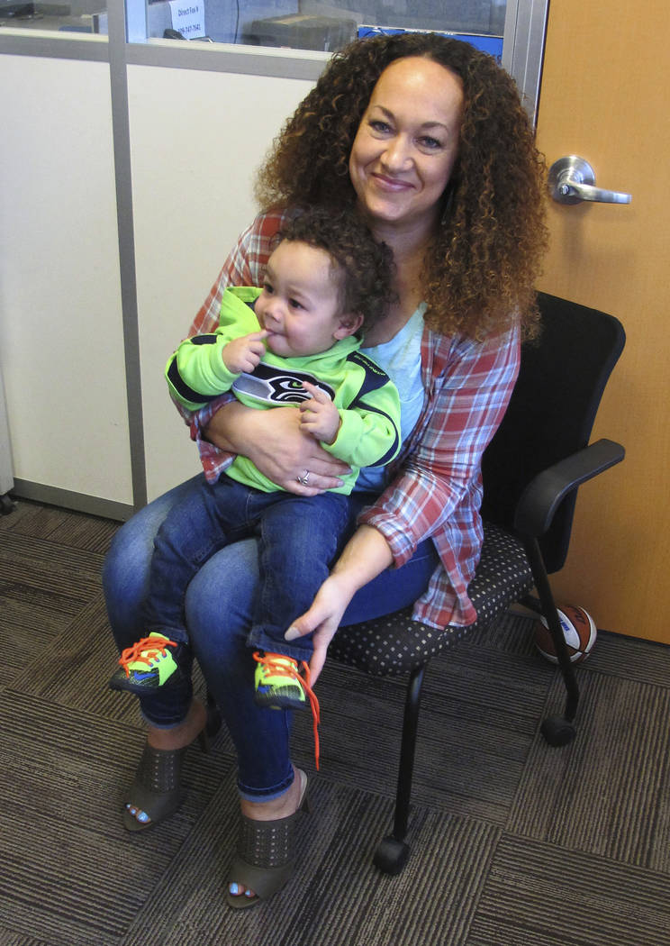 Rachel Dolezal poses for a photo with her son, Langston in the bureau of the Associated Press in Spokane, Wash. (Nicholas K. Geranios/AP)