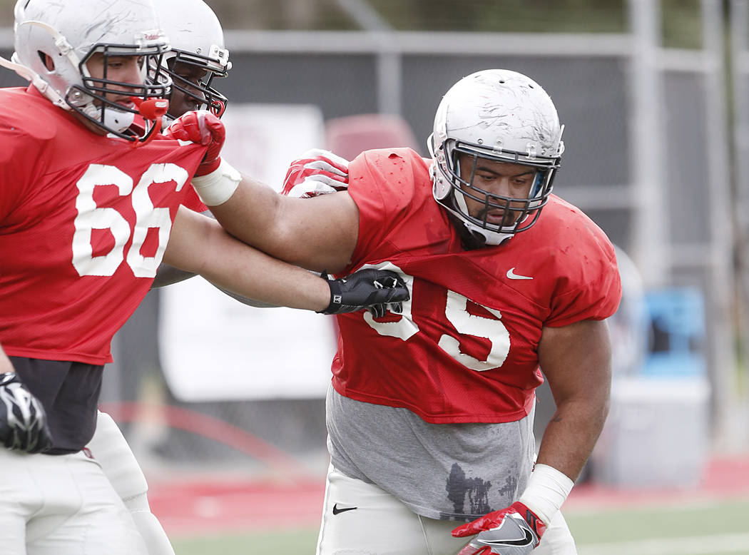 UNLV Rebels defensive line Jason Fao (95) defends defensive line Ammir Aziz during team's practice on Monday, March 20, 2017, in Las Vegas. (Bizuayehu Tesfaye/Las Vegas Review-Journal) @bizutesfaye