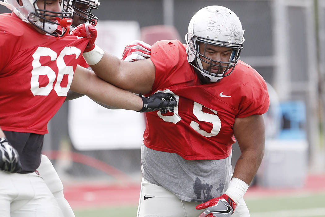 UNLV Rebels defensive line Jason Fao (95) defends defensive line Ammir Aziz during team's practice on Monday, March 20, 2017, in Las Vegas. (Bizuayehu Tesfaye/Las Vegas Review-Journal) @bizutesfaye