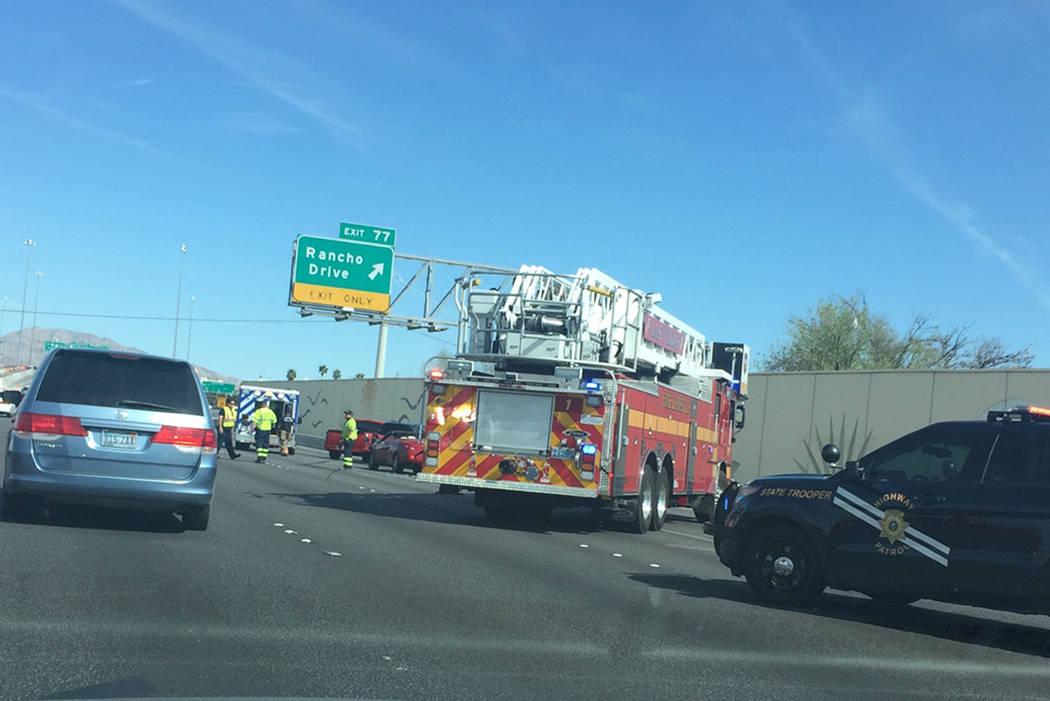 Emergency crews on the scene of an afternoon crash on U.S. 95 that occurred before a second incident in which a pickup struck a Nevada Highway Patrol vehicle. (Las Vegas Review-Journal)