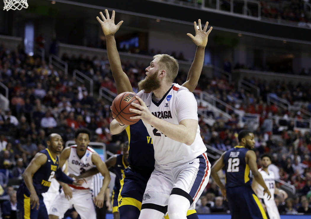 Gonzaga center Przemek Karnowski shoots against West Virginia during the second half of an NCAA Tournament college basketball regional semifinal game Thursday, March 23, 2017, in San Jose, Calif. ...