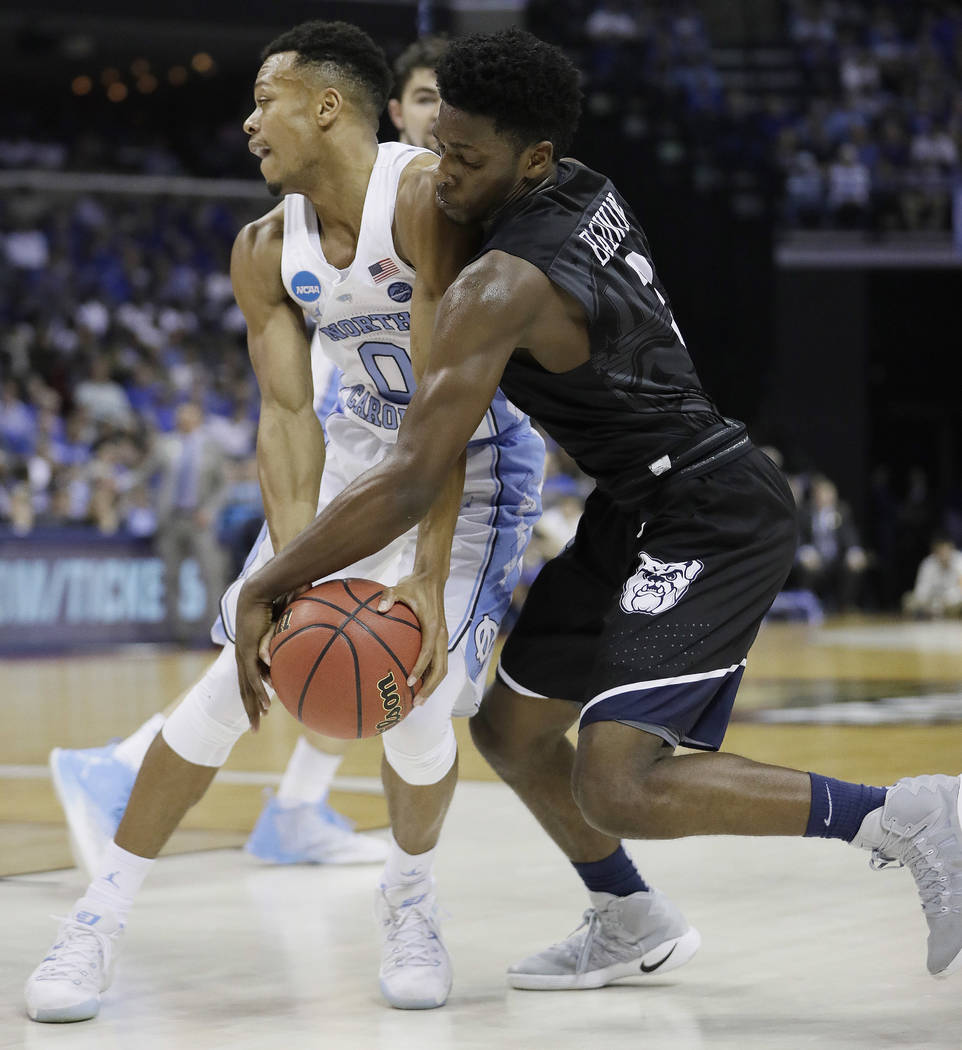 Butler guard Kamar Baldwin works for the ball against North Carolina guard Nate Britt in the second half of an NCAA college basketball tournament South Regional semifinal game Friday, March 24, 20 ...