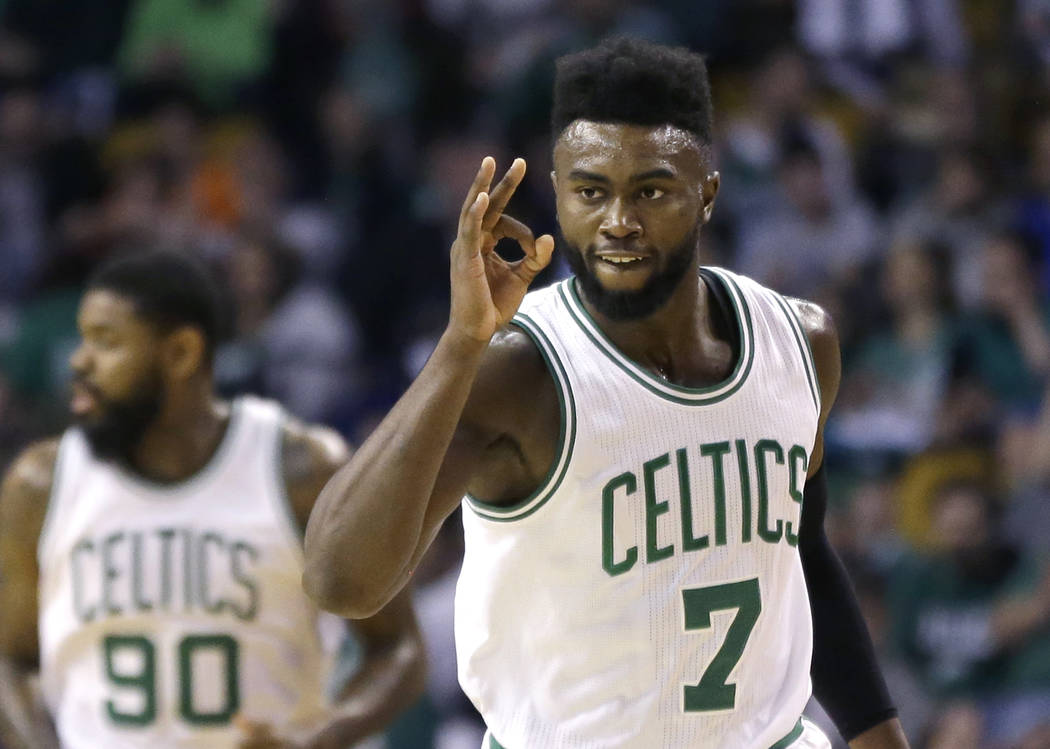 Boston Celtics forward Jaylen Brown (7) gestures after making a 3-point shot against the Phoenix Suns during the first quarter of an NBA basketball game, Friday, March 24, 2017, in Boston. (AP Pho ...