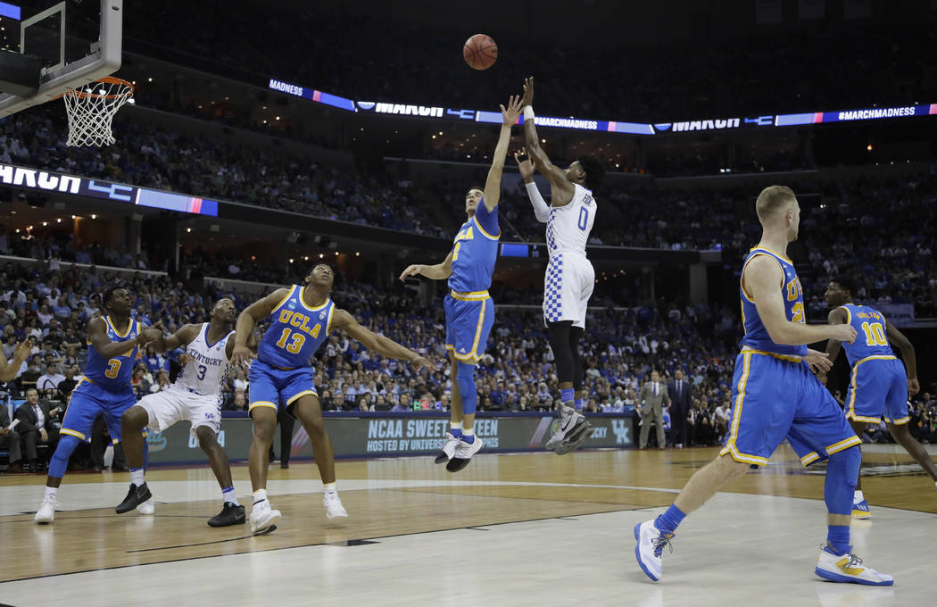 Kentucky guard De'Aaron Fox shoots against UCLA in the first half of an NCAA college basketball tournament South Regional semifinal game Friday, March 24, 2017, in Memphis, Tenn. (AP Photo/Mark Hu ...
