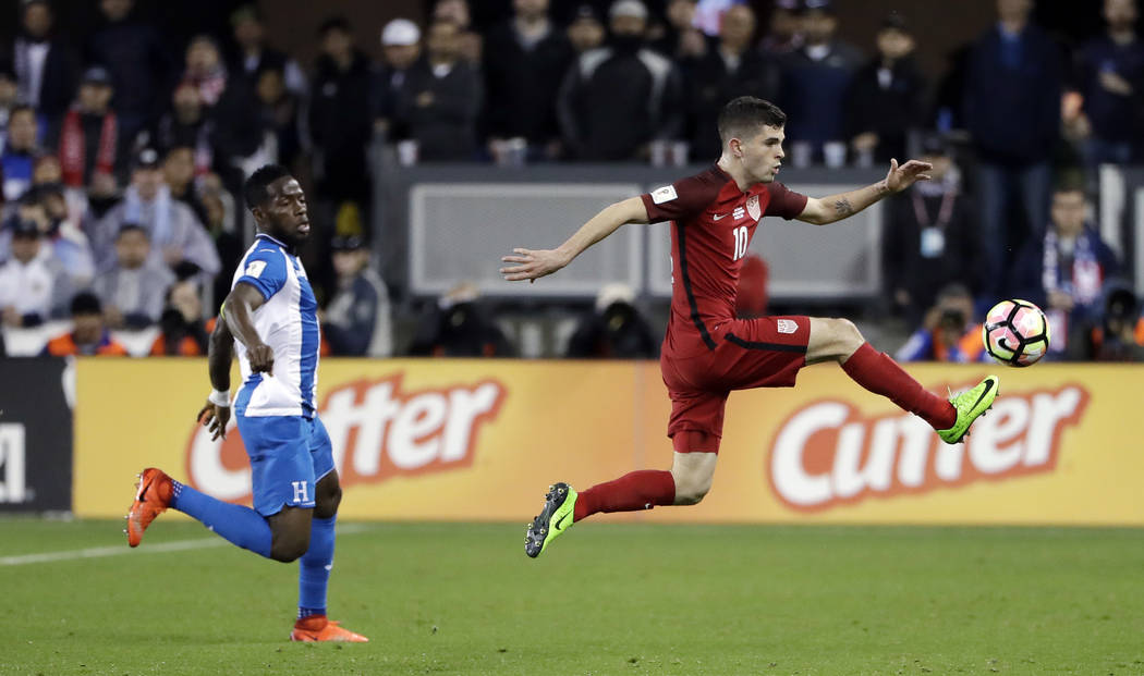 United States' Christian Pulisic, right, stops a pass next to a Honduras defender during the first half of a World Cup qualifying soccer match Friday, March 24, 2017, in San Jose, Calif. (AP Photo ...