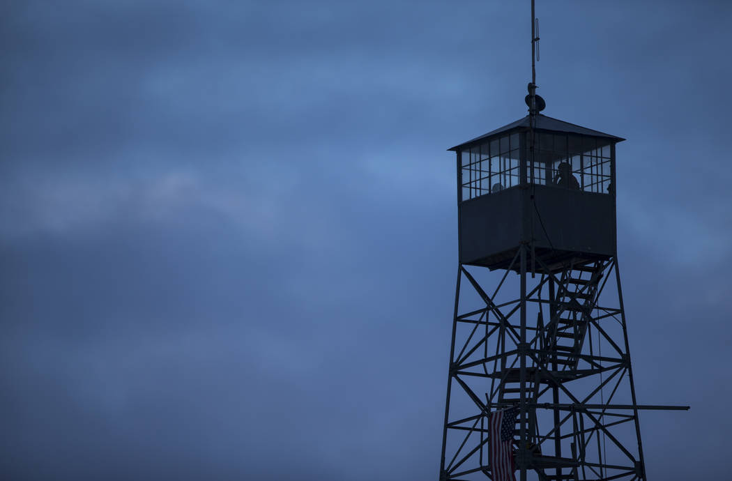Anti-government protesters stand in a watch tower at the Malheur National Wildlife Refuge headquarters, which the group is occupying, near Burns, Ore. on Thursday, Jan. 7, 2016. The protesters, ma ...