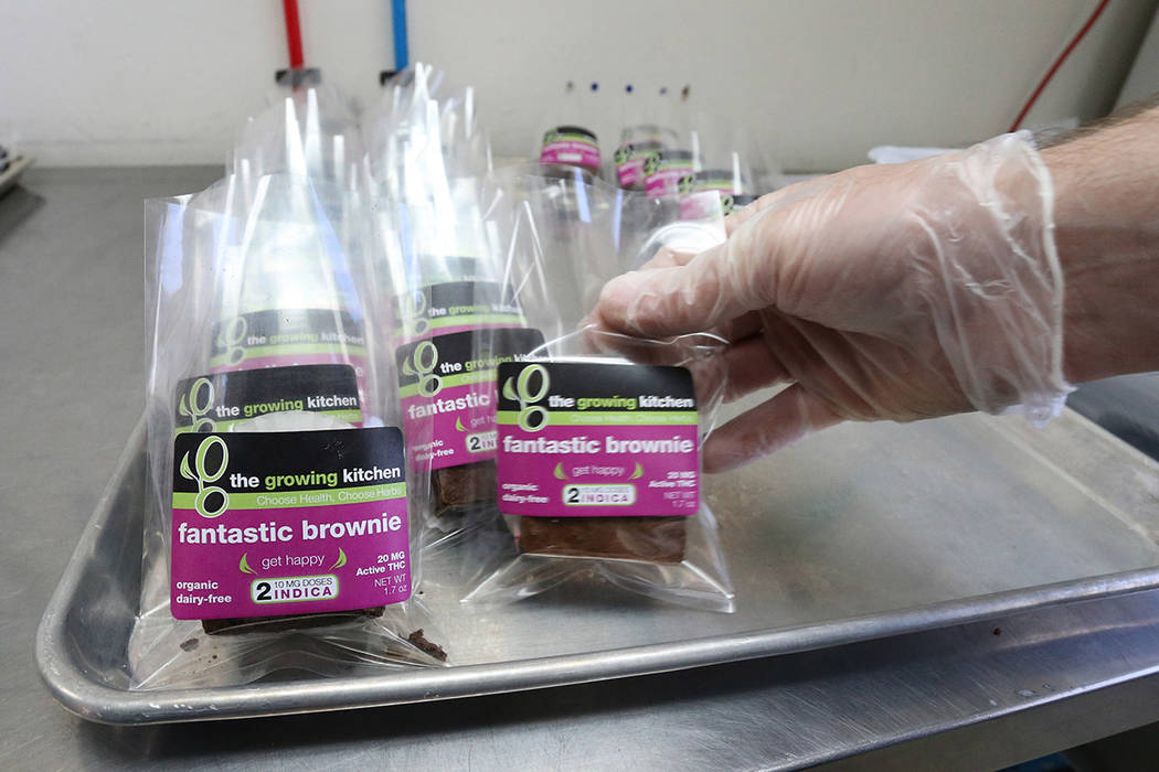 In this Sept. 26, 2014, file photo, smaller-dose pot-infused brownies are packaged at The Growing Kitchen in Boulder, Colo. (AP Photo/Brennan Linsley, File)