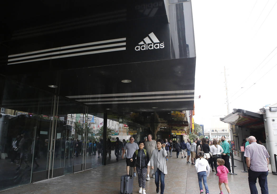 People walk pass the Adidas store, at Showcase Mall, 3785 Las Vegas Boulevard South near the M&M store, which is under construction Friday, March 31, 2017, in Las Vegas. (Christian K. Lee/Las ...
