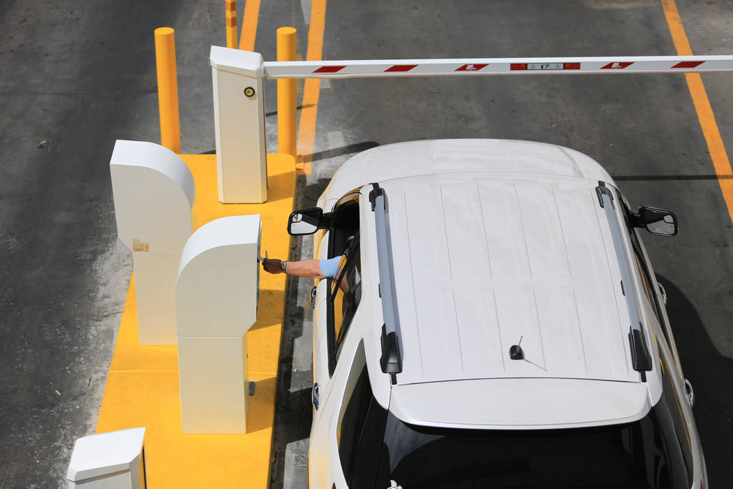 A driver stops to work the new parking gates at the Linq hotel-casino in Las Vegas on Thursday, ...