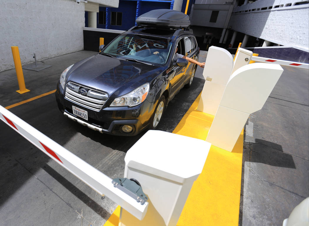 A driver stops to work the new parking gates at the Linq hotel-casino in Las Vegas on Thursday, ...