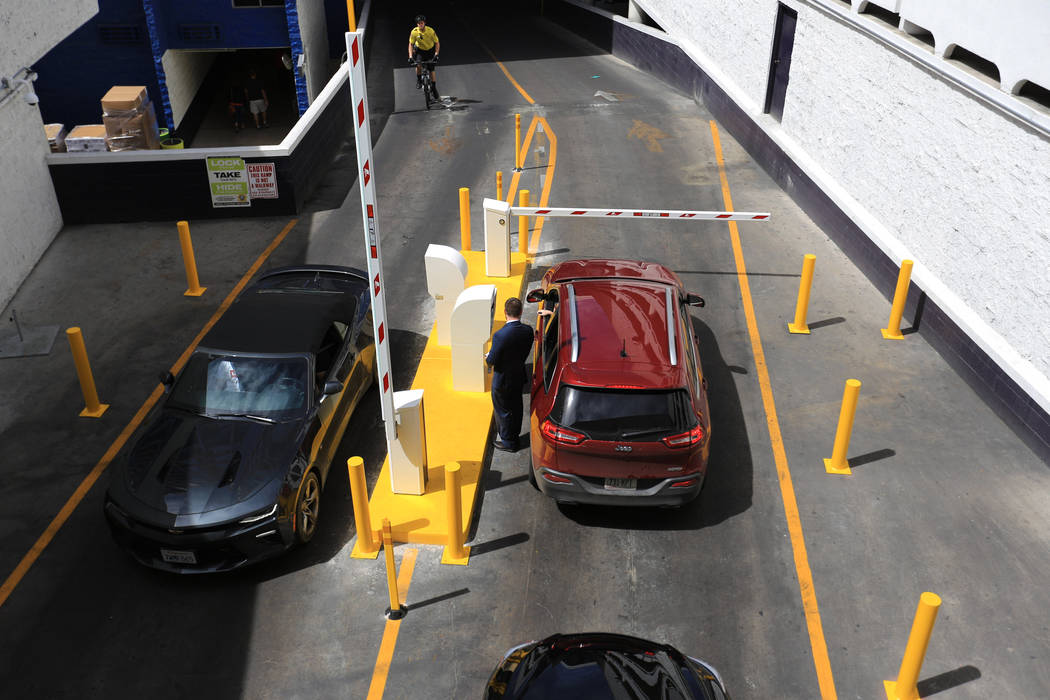 Drivers stop to work the new parking gates at the Linq hotel-casino in Las Vegas on Thursday, March 30, 2017. Some Caesars Entertainment properties have begun charging for parking. Nevada resident ...