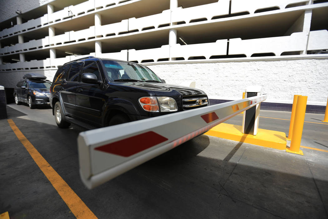 Drivers stop to work the new parking gates at the Linq hotel-casino in Las Vegas on Thursday, March 30, 2017. Some Caesars Entertainment properties have begun charging for parking. Nevada resident ...