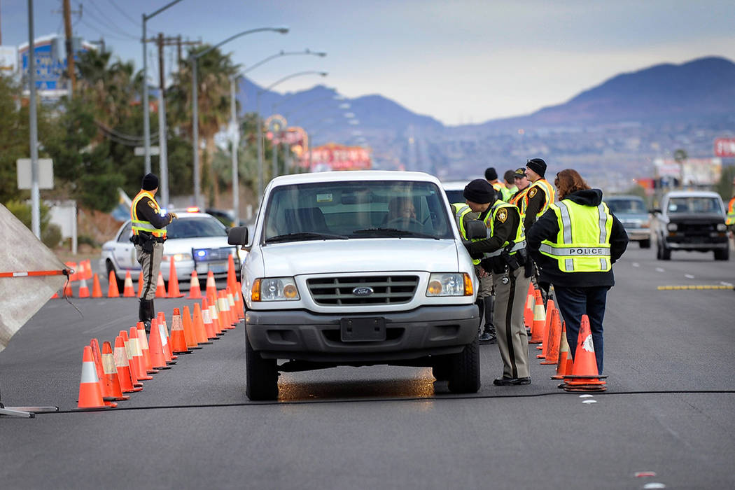 Las Vegas police officer Beth Choat speaks with a driver at a DUI check point along Boulder Highway on Sunday, Feb. 2, 2014. (David Becker/Las Vegas Review-Journal)
