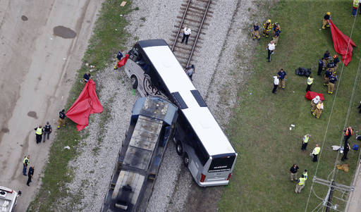 Responders works the scene where a train hit a bus in Biloxi, Mississippi, Tuesday, March 7, 2017.  (Gerald Herbert/AP)