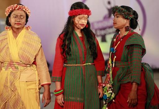 In this March 7, 2017 photo, a Bangladeshi acid attack survivor walk down the catwalk during the event 'Beauty Redefined' in Dhaka, Bangladesh. Organizers said they hoped to highlight the fact tha ...