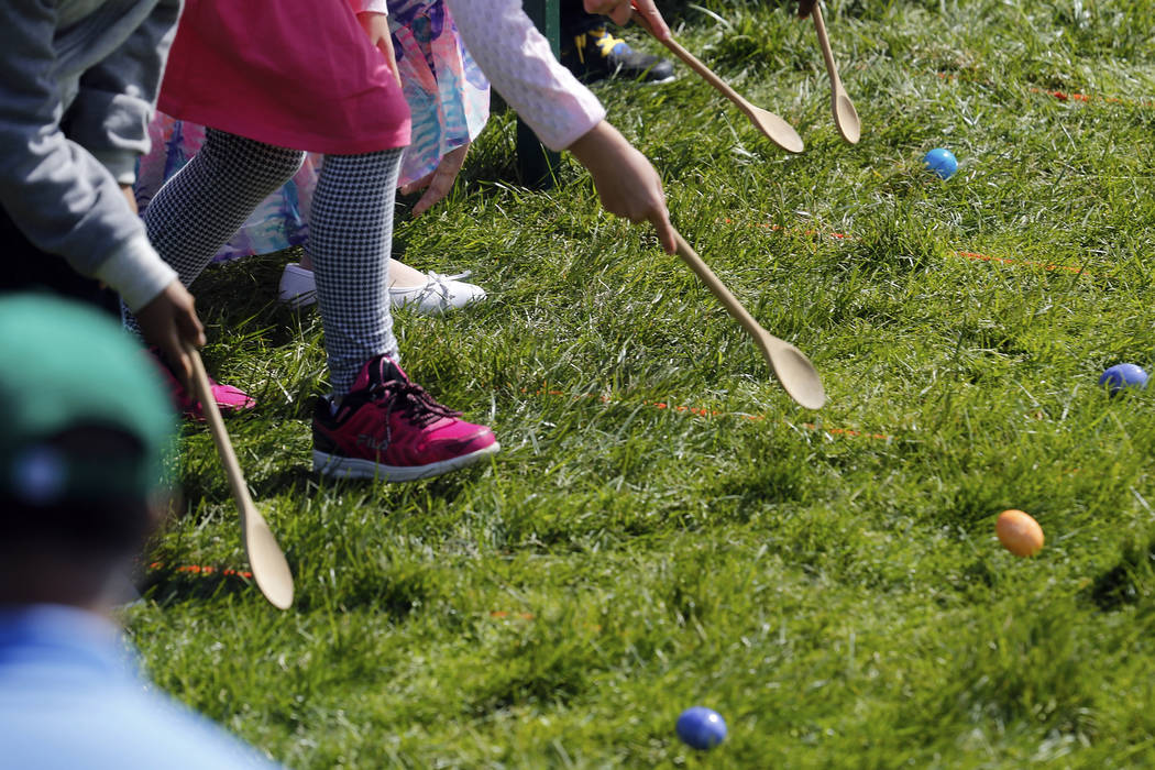 Children participate in the annual Easter Egg Roll on the South Lawn of the White House in Washington April 21, 2014. (Jonathan Ernst/Reuters)