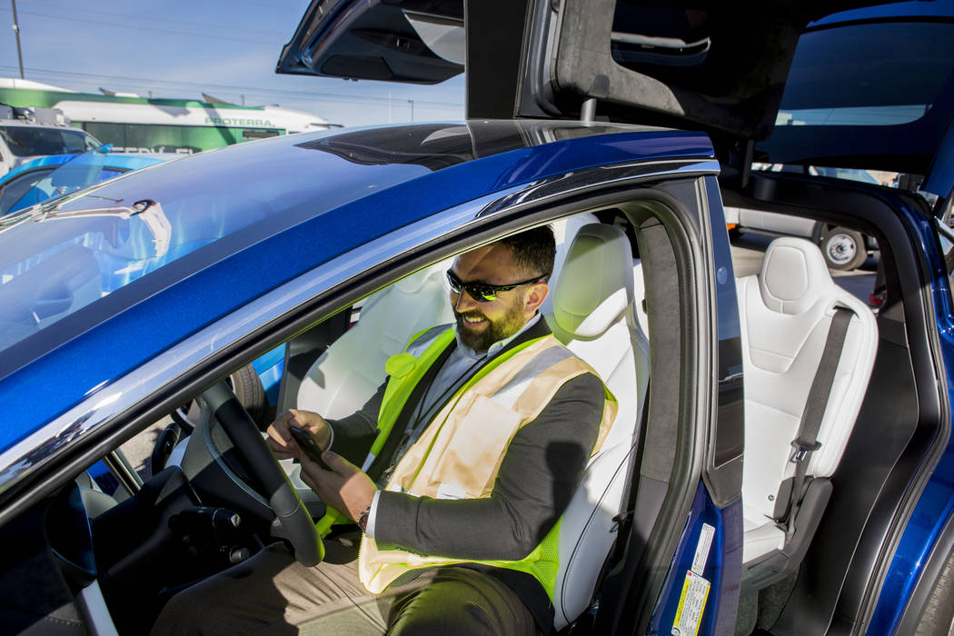 Daniel Fazekas, senior regional planner of Southern Nevada Strong, sits in a Model X Tesla SUV crossover at the Regional Transportation Commission of Southern Nevada RTC Training Center, Wednesday ...