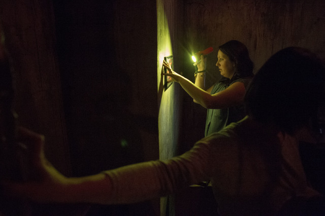 Participant Marguerite Clark pieces together clues in an attempt to find a way out of The Basement escape room in Las Vegas. (Bridget Bennett/Las Vegas Review-Journal) @bridgetkb