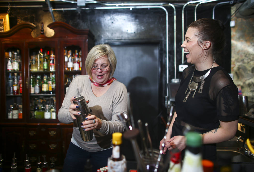 Sharon Bond, left, makes a whiskey sour as instructor Christina Dylag looks on during a cocktail class at Velveteen Rabbit in downtown Las Vegas on Saturday, Feb. 25, 2017. (Chase Stevens/Las Vega ...