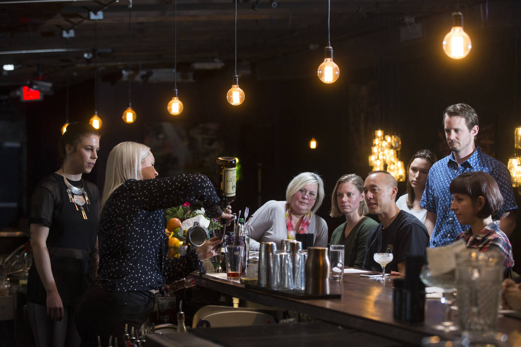 Students look on as instructor Pamela Dylag makes an old fashioned during a cocktail class at Velveteen Rabbit in downtown Las Vegas on Saturday, Feb. 25, 2017. (Chase Stevens/Las Vegas Review-Jou ...