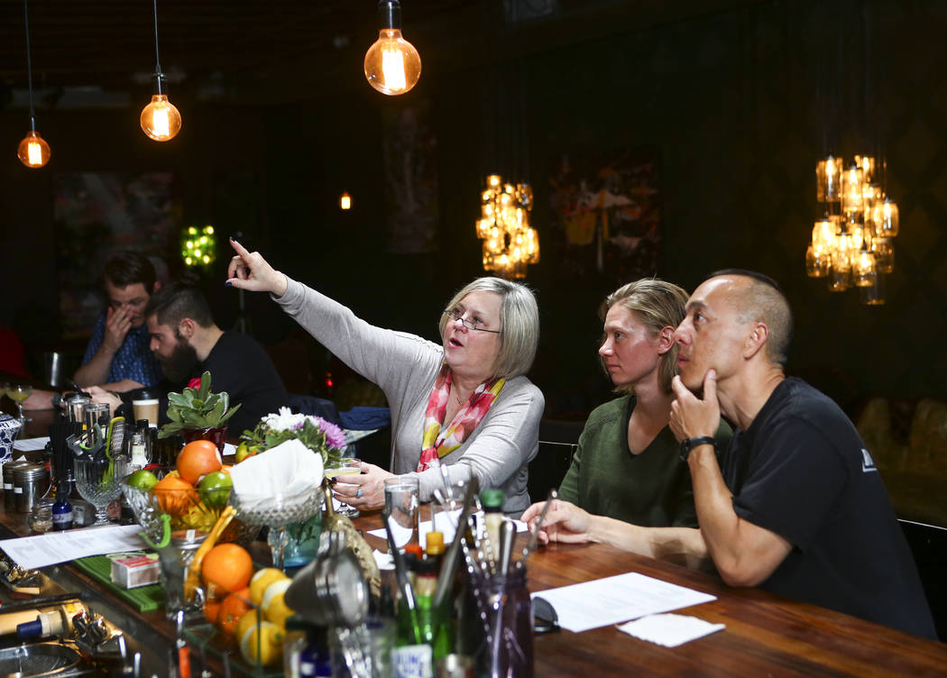 Sharon Bond, from left, Lydia Peteresen and Bill Yadao look on during a cocktail class at Velveteen Rabbit in downtown Las Vegas on Saturday, Feb. 25, 2017. (Chase Stevens/Las Vegas Review-Journal ...