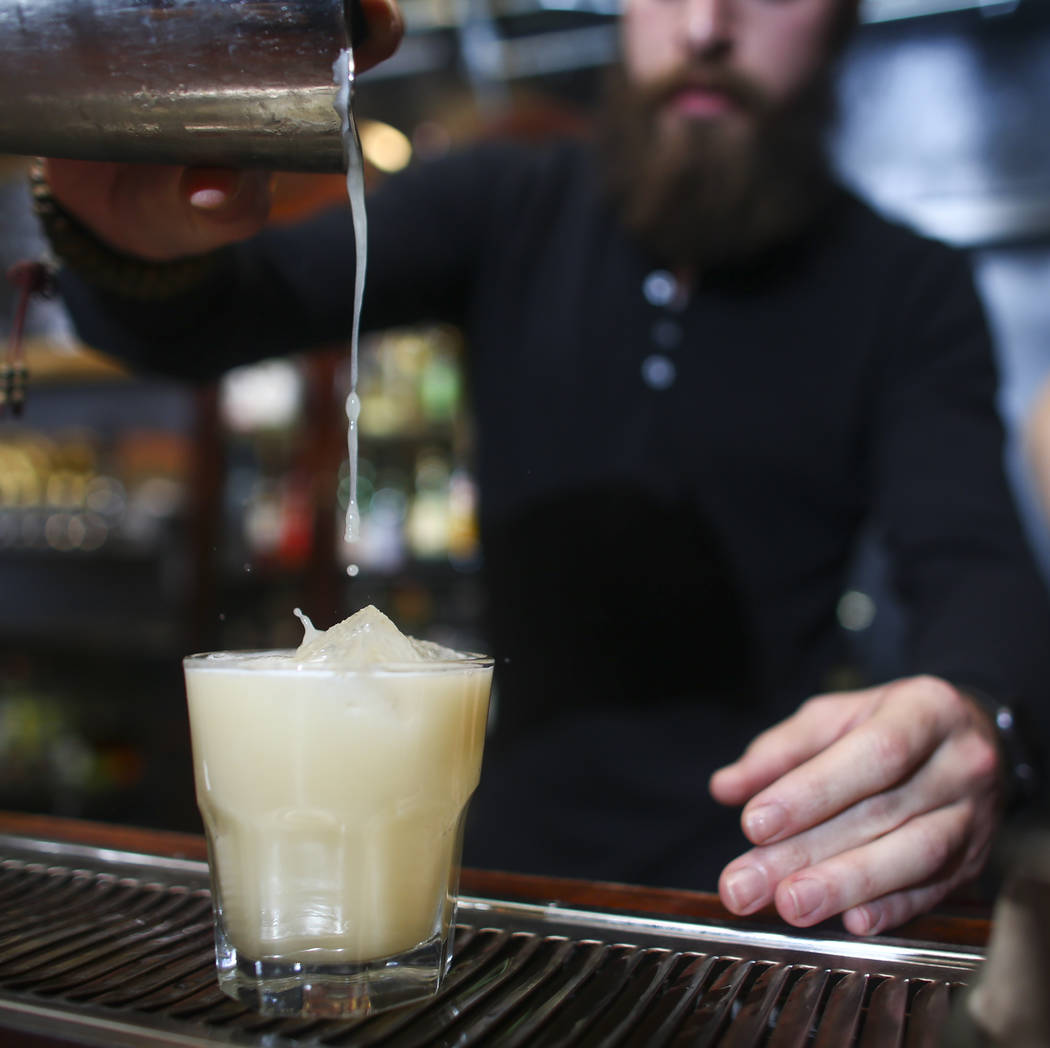Jason Bornstein pours a whiskey sour during a cocktail class at Velveteen Rabbit in downtown Las Vegas on Saturday, Feb. 25, 2017. (Chase Stevens/Las Vegas Review-Journal) @csstevensphoto