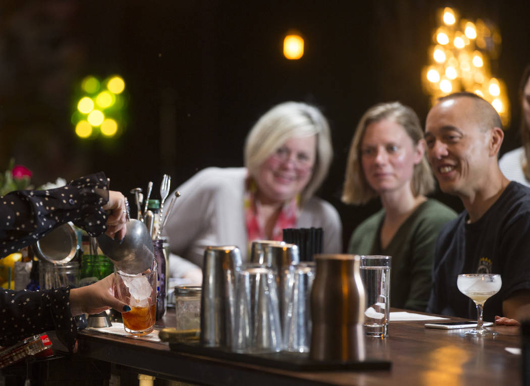 Students look on as instructor Pamela Dylag makes an old fashioned during a cocktail class at Velveteen Rabbit in downtown Las Vegas on Saturday, Feb. 25, 2017. (Chase Stevens/Las Vegas Review-Jou ...
