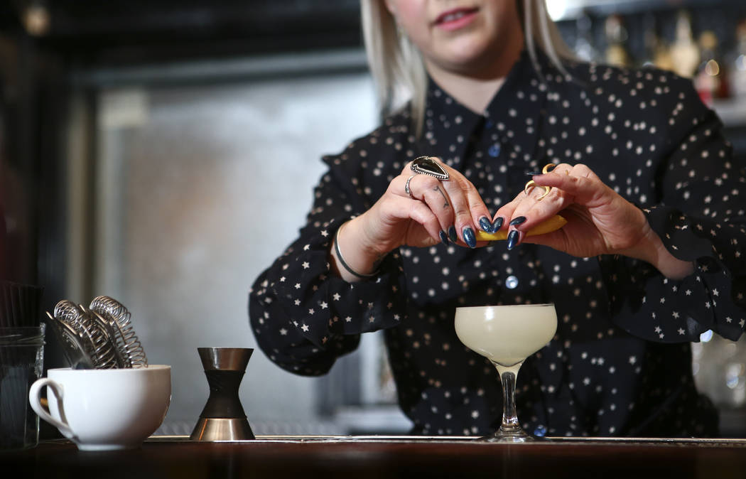 Instructor Pamela Dylag squeezes a lemon while making a French 75 during a cocktail class at Velveteen Rabbit in downtown Las Vegas on Saturday, Feb. 25, 2017. (Chase Stevens/Las Vegas Review-Jour ...
