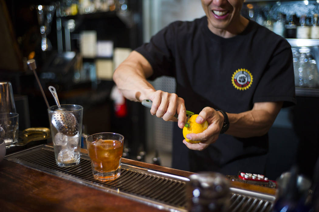 Bill Yadao peels a lemon before garnishing an old fashioned during a cocktail class at Velveteen Rabbit in downtown Las Vegas on Saturday, Feb. 25, 2017. (Chase Stevens/Las Vegas Review-Journal) @ ...