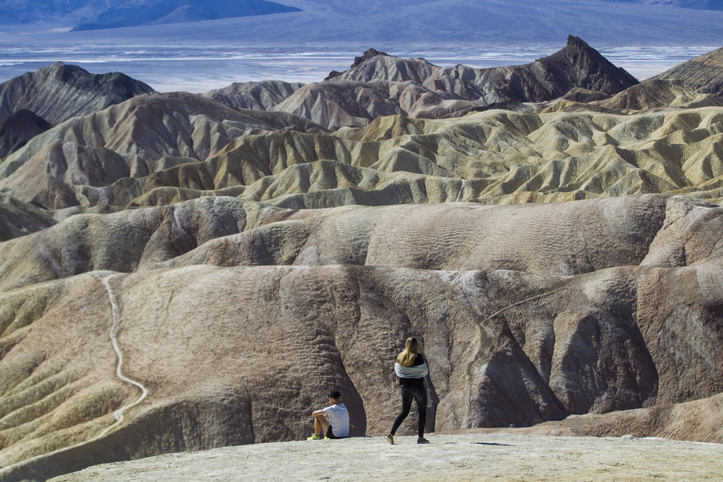 People at Zabriskie Point in Death Valley National Park on Tuesday, Feb. 28, 2017. The cover art of rock band U2's "The Joshua Tree" was taken at the popular tourist spot at the ...