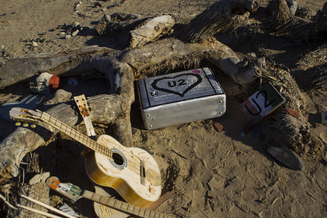 The remains of the tree featured in the album artwork of U2's 1987 album "The Joshua Tree" is shown with tributes and memorabilia outside of Death Valley National Park along Cali ...