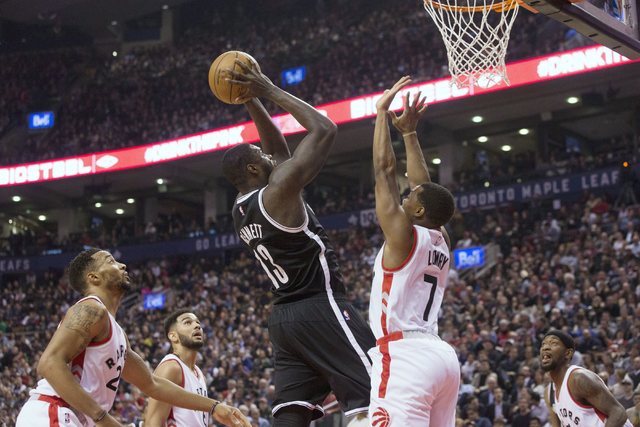 Brooklyn Nets forward Anthony Bennett (13) shoots on Toronto Raptors guard Kyle Lowry during first half NBA basketball action in Toronto on Tuesday, Dec. 20, 2016. (Chris Young/The Canadian Press  ...