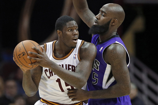 Cleveland Cavaliers' Anthony Bennett, left, tries to get past Sacramento Kings' Quincy Acy during the third quarter of an NBA basketball game Tuesday, Feb. 11, 2014, in Cleveland. Bennett scored 1 ...