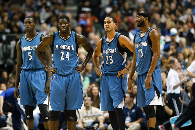 Minnesota Timberwolves center Gorgui Dieng (5) and Minnesota forward Anthony Bennett (24) and  guard Kevin Martin (23) and  guard Corey Brewer (13) react during the game against the Dallas Maveric ...
