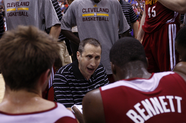 Cleveland head coach David Blatt, middle, offers instructions to second year player Anthony Bennett during their NBA Summer League game at the Cox Pavilion in Las Vegas on Friday, July 11, 2014. ( ...