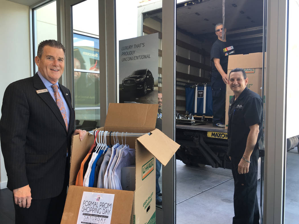 COURTESY
Park Place Infiniti General Manager Rob Schweizer and lead valet Pedro Ponce load donations for the Las Vegas Prom Closet event. The March 18 event put on by nonprofit Project 150 and Zap ...