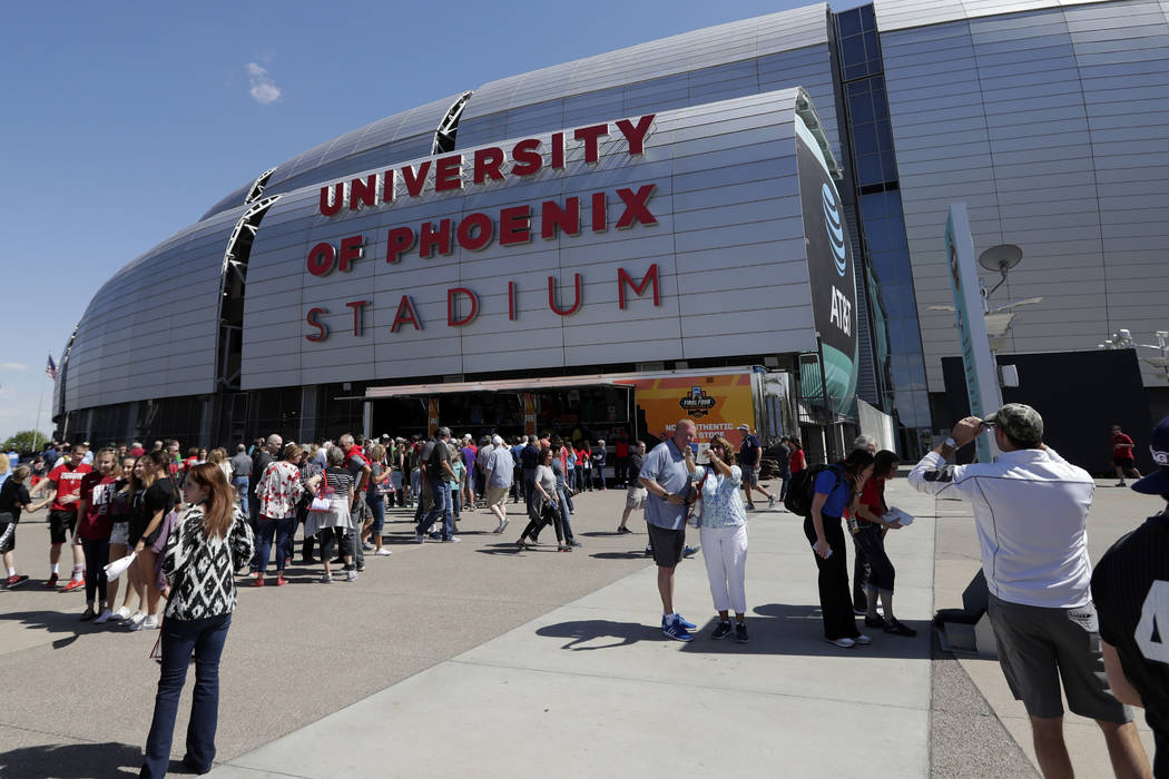 Fans arrive at University of Phoenix Stadium before the semifinals of the Final Four NCAA college basketball tournament between South Carolina and Gonzaga, Saturday, April 1, 2017, in Glendale, Ar ...