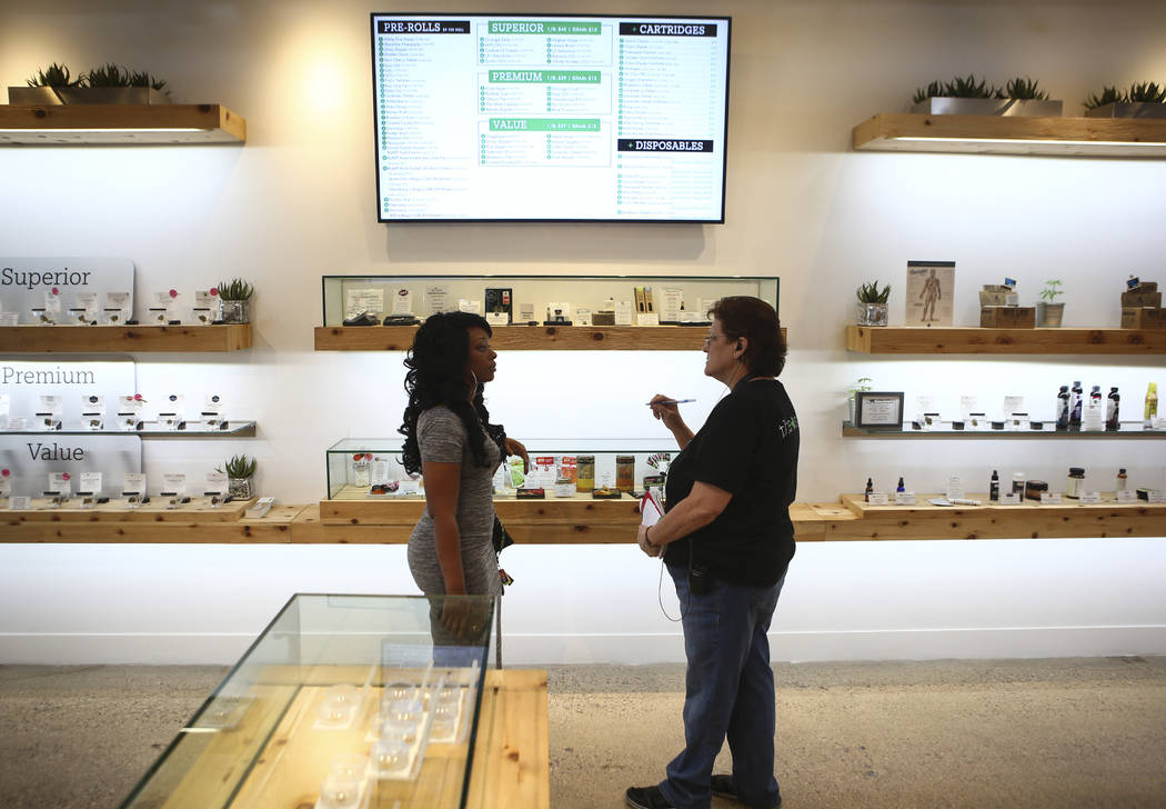 Patient advisor Carol Booth, right, assists Jennifer, who declined to give her last name, at medical marijuana dispensary The Source in Las Vegas on Thursday, March 30, 2017. (Chase Stevens/Las Ve ...