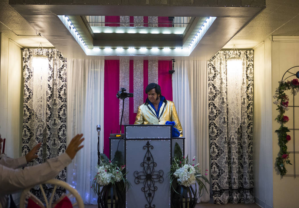 Elvis impersonator and wedding officiant Tim Ritchey prepares for a ceremony at the Little Vegas Chapel in Las Vegas on Saturday, April 1, 2017. (Chase Stevens/Las Vegas Review-Journal) @csstevens ...