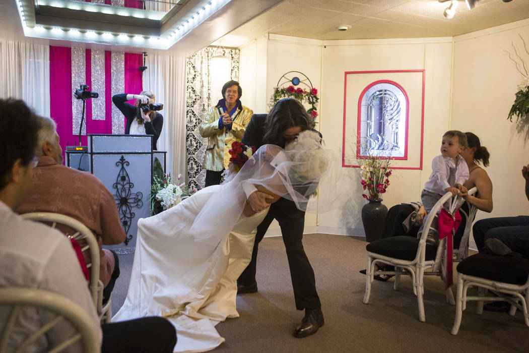 Lauren Santiago and David Wenzel kiss during their wedding ceremony at the Little Vegas Chapel in Las Vegas on Saturday, April 1, 2017. (Chase Stevens/Las Vegas Review-Journal) @csstevensphoto