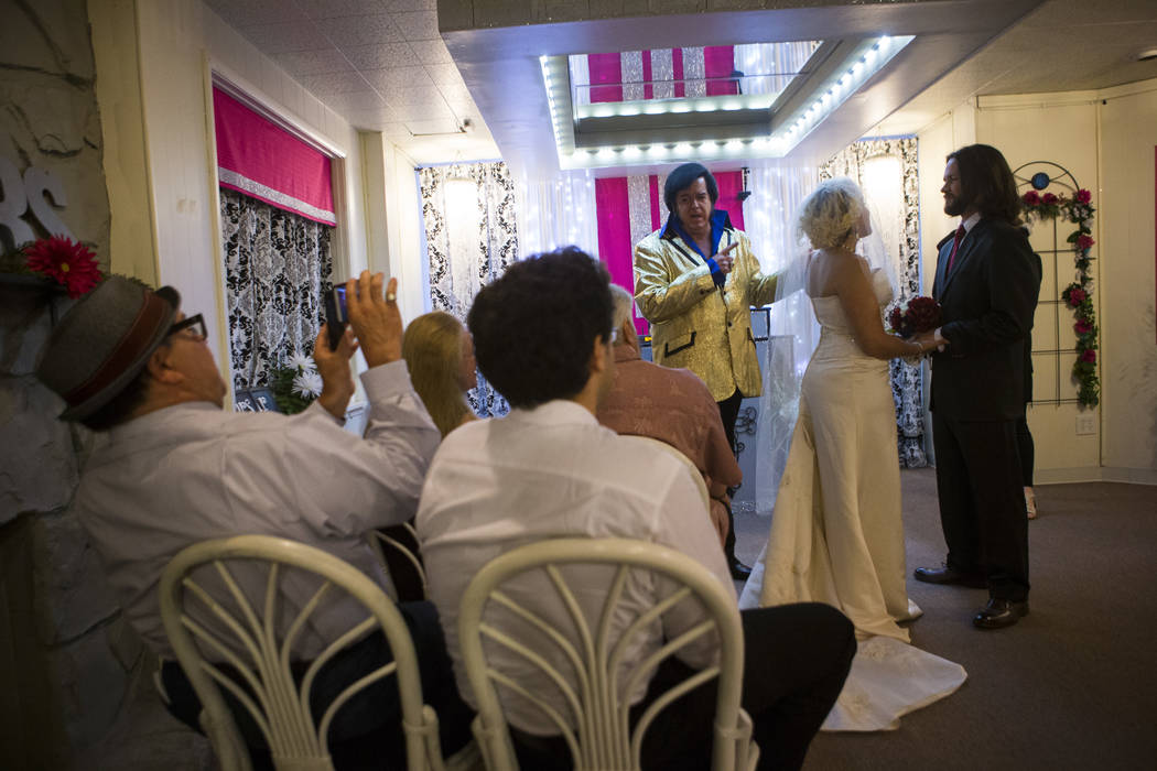 Lauren Santiago and David Wenzel during their wedding ceremony at the Little Vegas Chapel in Las Vegas on Saturday, April 1, 2017. (Chase Stevens/Las Vegas Review-Journal) @csstevensphoto