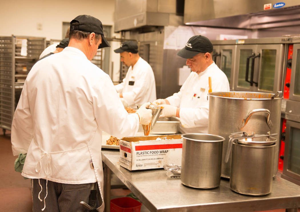 Line cooks preparing food in the hot kitchen for 3,000 people at the Mandalay Bay. Todd Prince Las Vegas Review-Journal