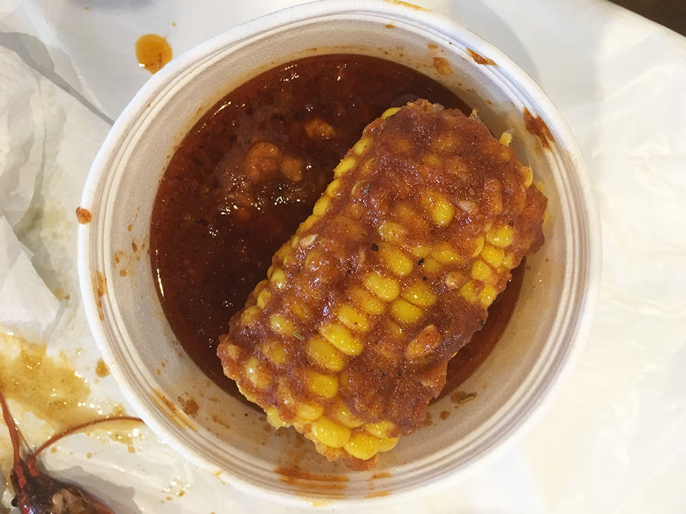 A side of corn on the cob came with an ample supply of sauce. (Brian Sandford/View)