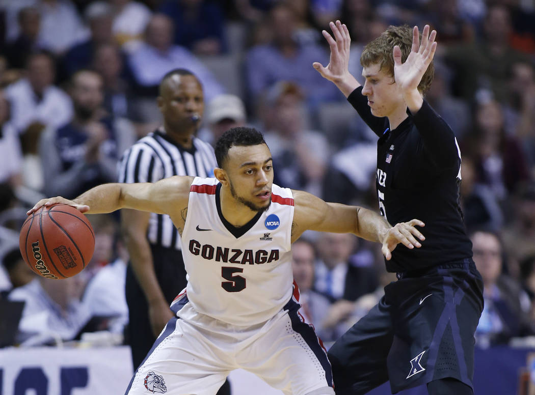 Gonzaga guard Nigel Williams-Goss (5) is defended by Xavier guard J.P. Macura during the second half of an NCAA Tournament college basketball regional final game Saturday, March 25, 2017, in San J ...