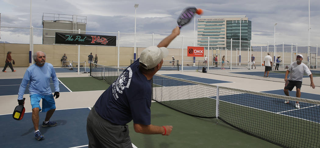 Joe Neeme, 69, from left, Scott Merritt, 59, and Mark Evans, 62, play a match during the Sin City Showdown pickleball tournament at the Plaza hotel-casino on Friday, April 7, 2017, in downtown Las ...