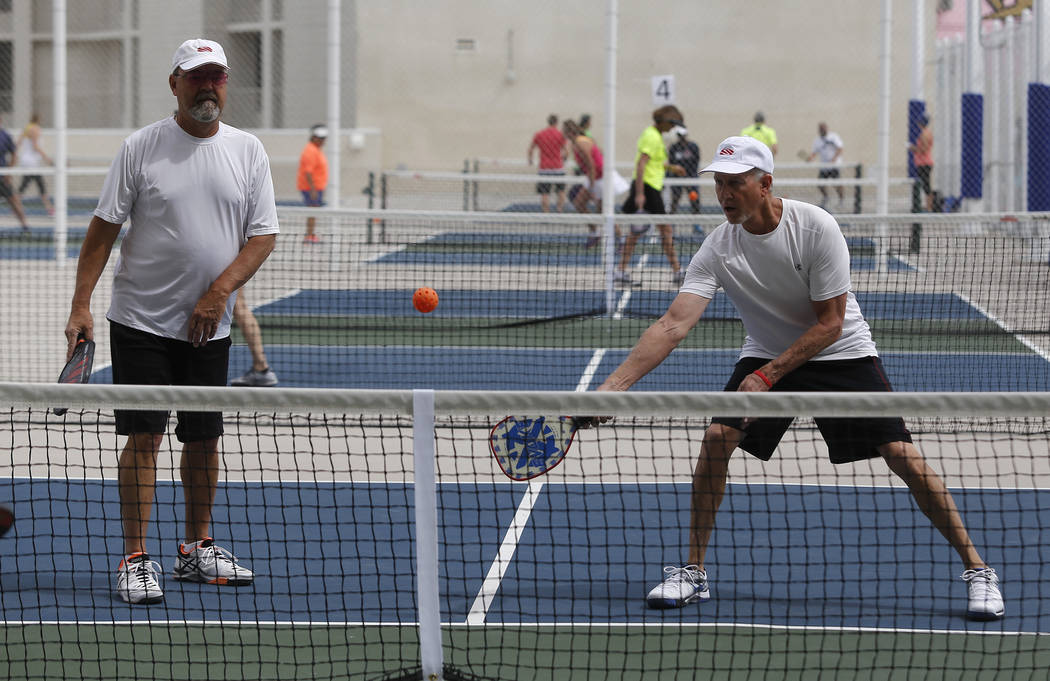 Mark Evans, 62, left, and Scott Resigner, 66, play a match during the Sin City Showdown pickleball tournament at the Plaza hotel-casino on Friday, April 7, 2017, in downtown Las Vegas. Christian K ...