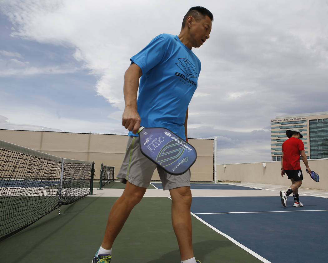 Phil Soo, 48, left, and Barry Mag, 58, after losing a match during the Sin City Showdown pickleball tournament at the Plaza hotel-casino on Friday, April 7, 2017, in downtown Las Vegas. Christian  ...